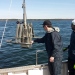 Forskare från Stockholms universitet tar sedimentprov från havsbotten utanför Askö i Sörmland.