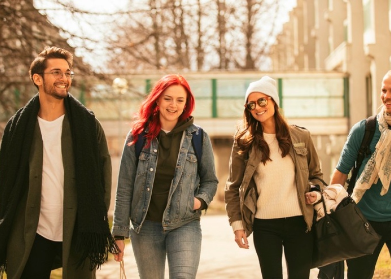 Four students walking at Campus.