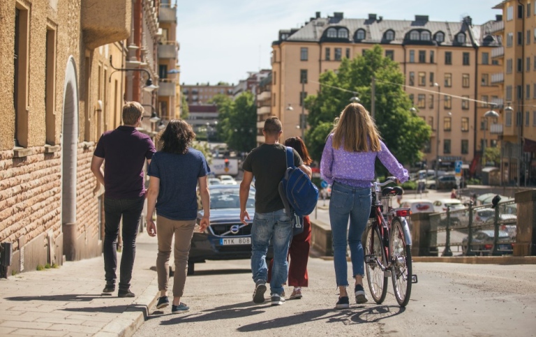A group of students walking on a street in Stockholm city