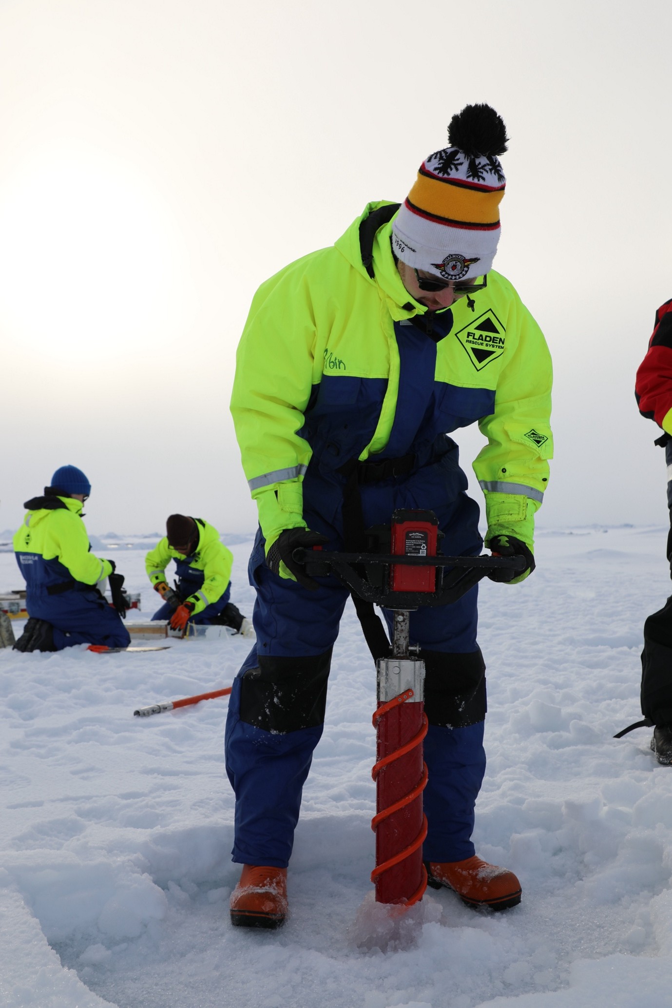 Caption: Albin Eriksson (Stockholm University) practices drilling an ice core.