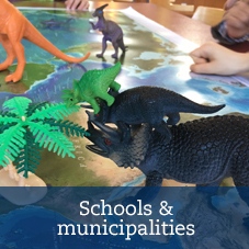 plastic dinosaurs on a  map