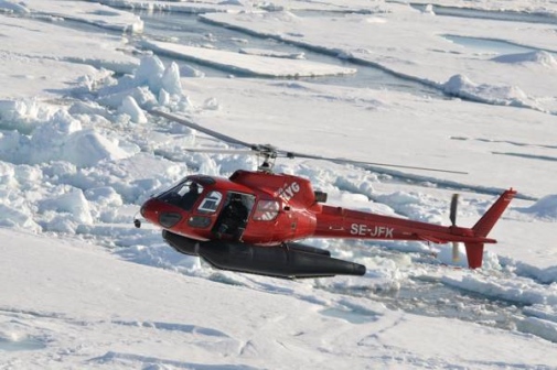 Lomrog 2009-08-04 Helicopter flying over sea ice under Lomrog expedition 2009