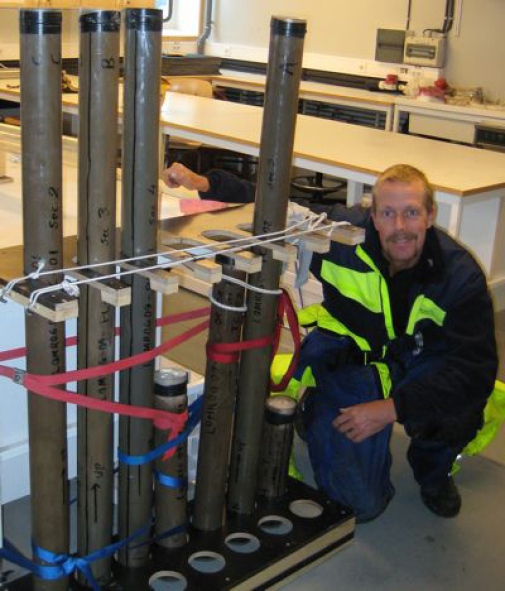 Lomrog 2009-08-15 Matti Karlström and some of the sediment cores we have taken so far.