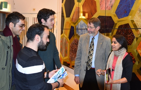 George Smith talking to PhD students after the lecture.