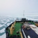 The foredeck of the icebreaker Oden with the atmospheric measurement tower, moving through sea ice with many melt ponds (blue areas) in the East Siberian Sea during the SWERUS-C3 project. Photo: Brett Thornton
