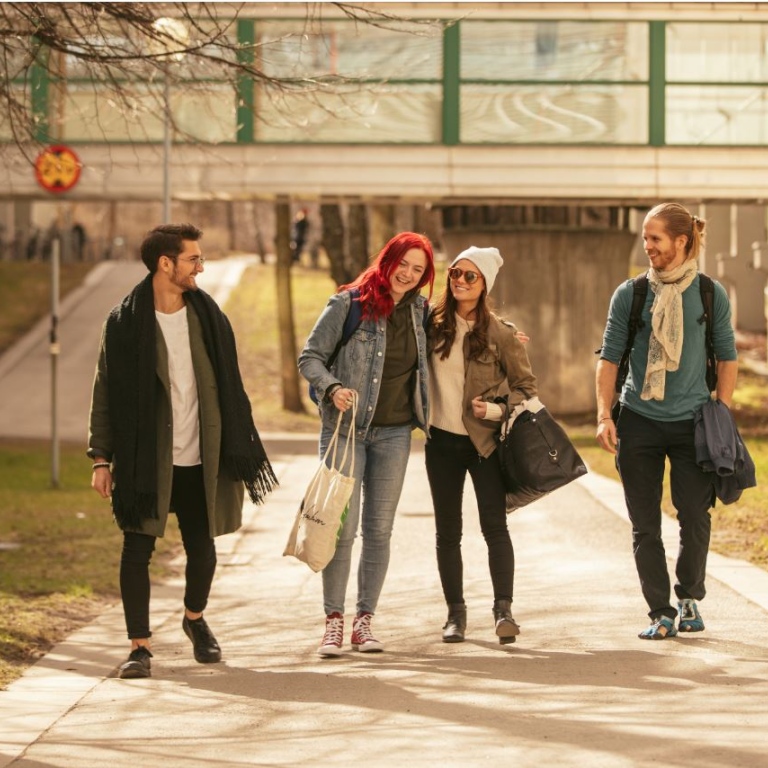 Happy students walking on campus. Photo: Niklas Björling