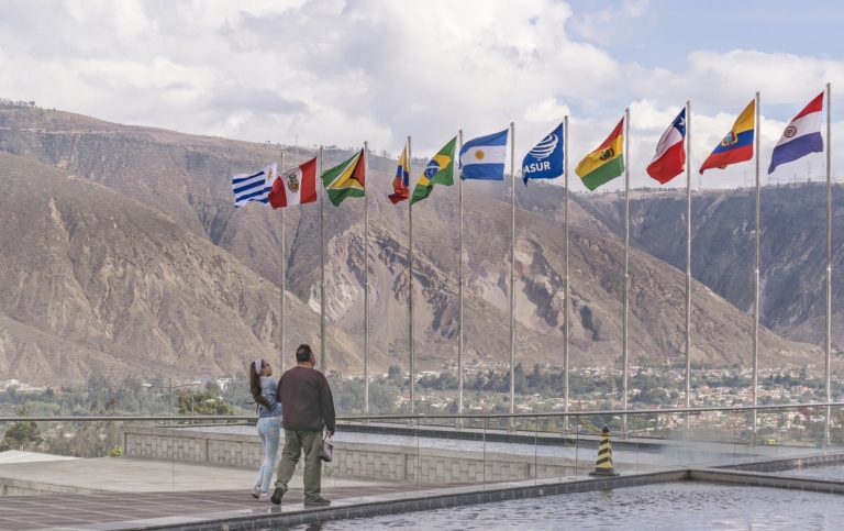 Couple watching flags waving 