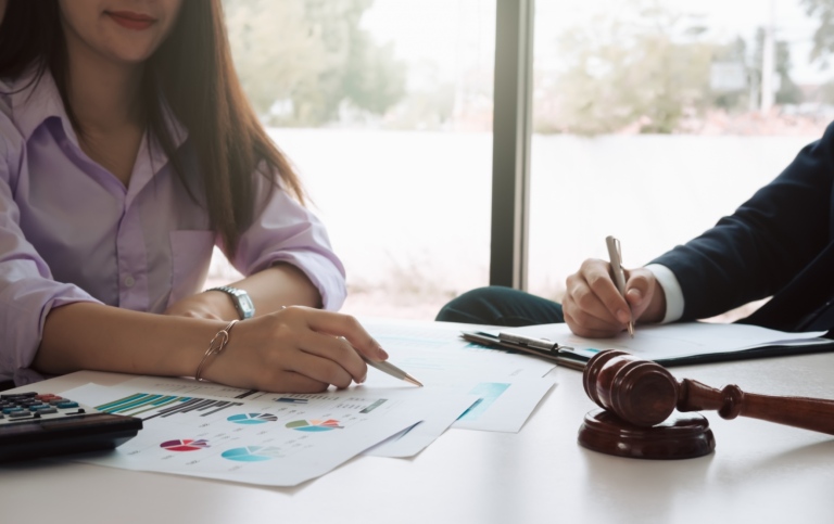 Consultation between business and lawyer about the tax
