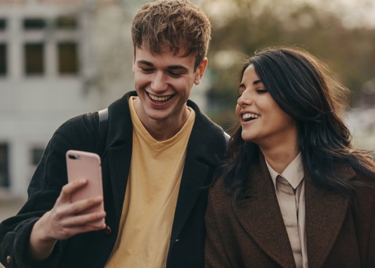 Students looking at a mobile phone