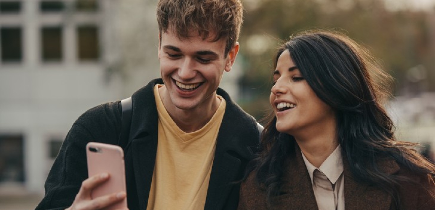 Students looking at a mobile phone