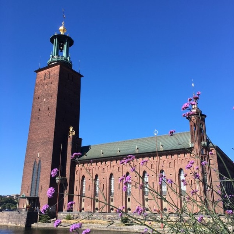 Stockholm City Hall, with its spire featuring the golden Three Crown. Photo Per Larsson.