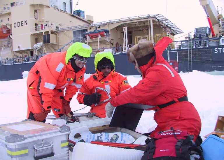 Fram Strait 2002. The researchers measure temperature in an ice core which is divided into 10 cm long pieces that are melted to measure salinity. Pauline Snoeijs Leijonmalm on the far right. Photo: Katarina Abrahamsson