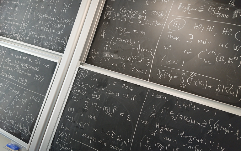Blackboard with mathematical formulas in chalk.