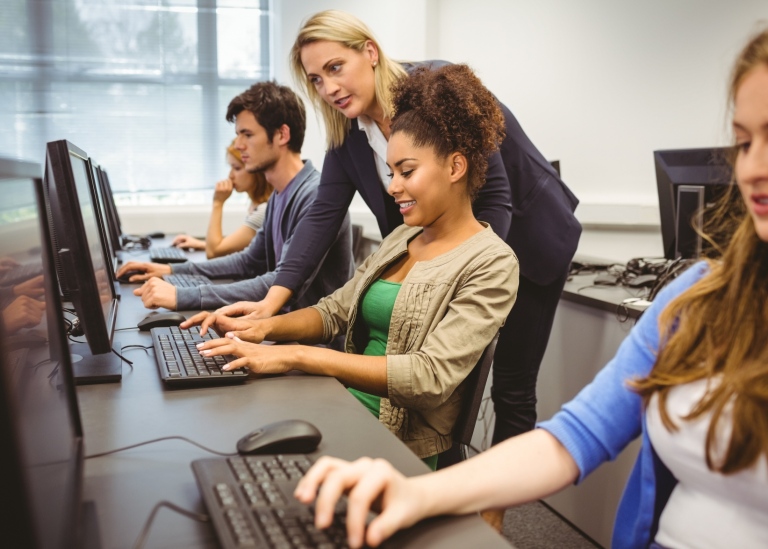 University teacher with her students. Photo: Wavebreakmedia © Mostphotos