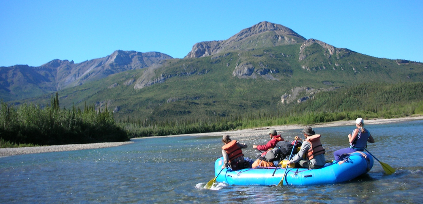 people on a rubber boat in a lake. Photo: Viictoria Pease