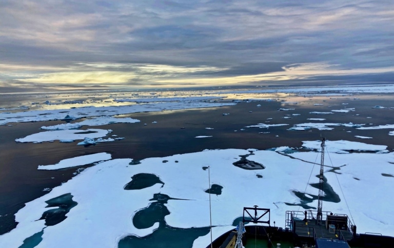 View of the ocean, with open water and sea ice covered with meltpond.Photo: Sonja Murto