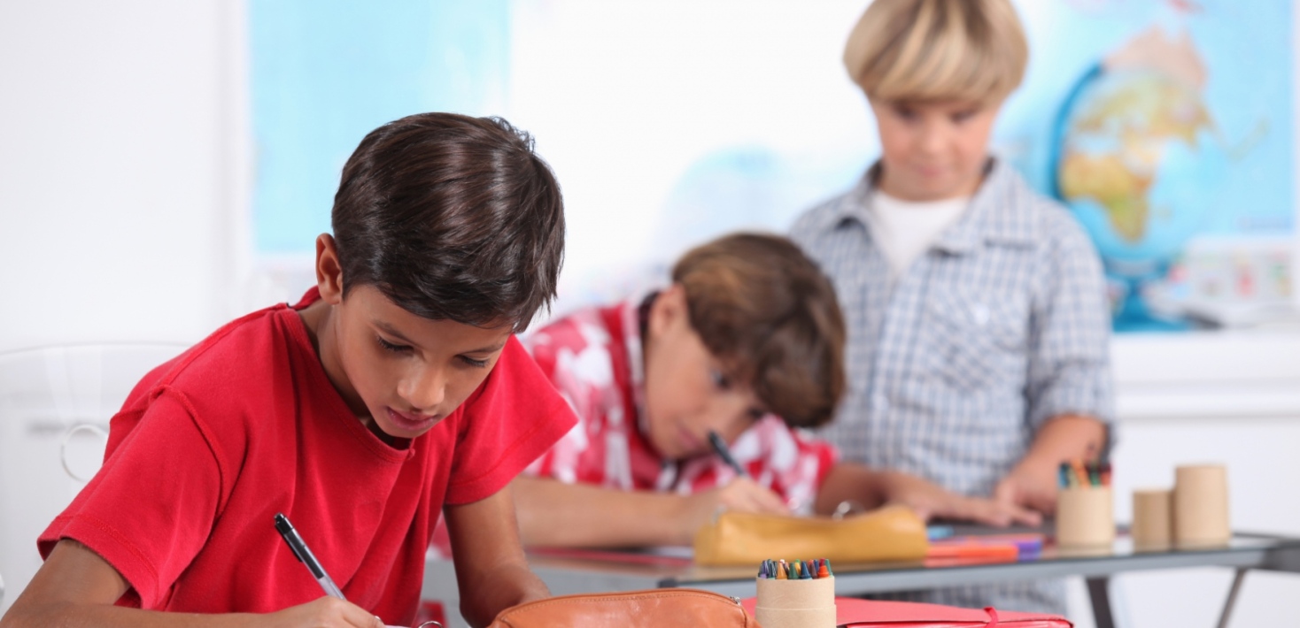 Children at school writing