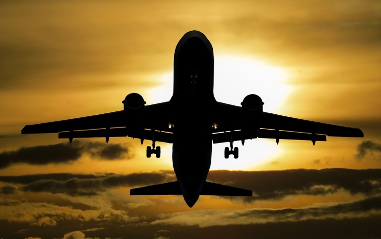Commercial jet lifting at sunset. Photo: Gerhard G. from Pixabay.