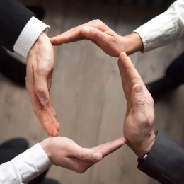 Business team people join hands forming circle