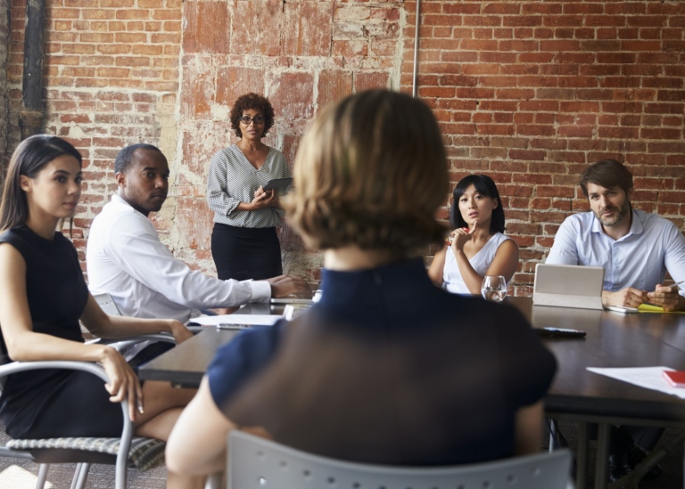 Business people gathered around a table