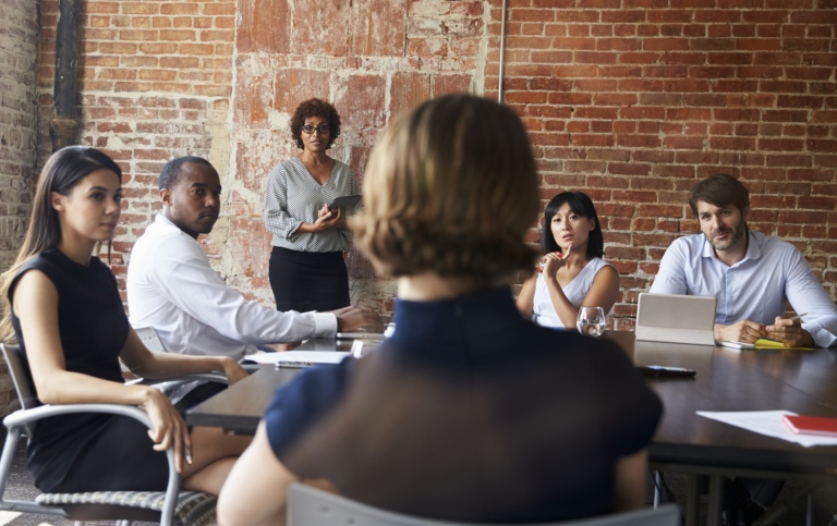 Business people gathered around a table