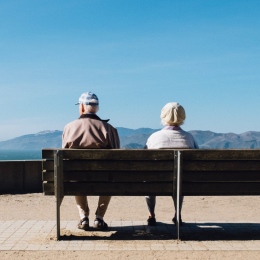 Old couple sitting on a bench