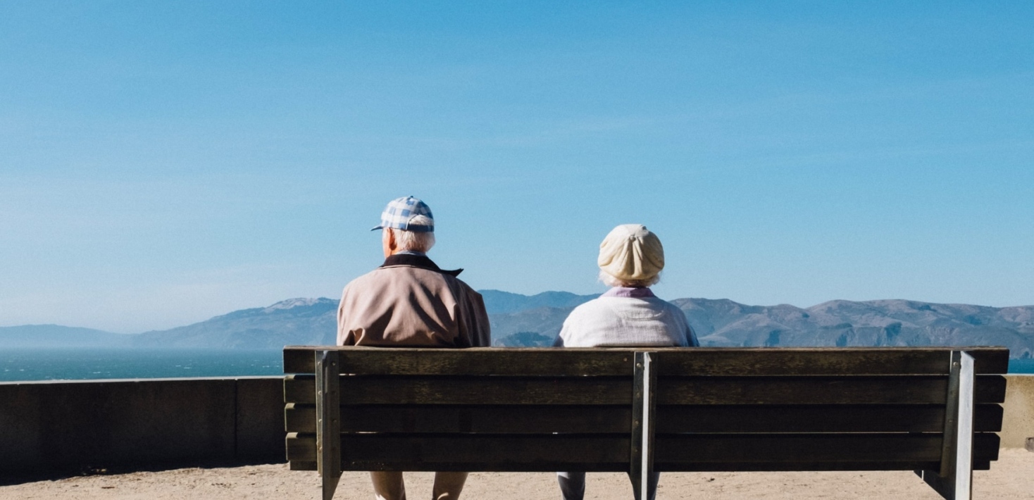 Old couple sitting on a bench