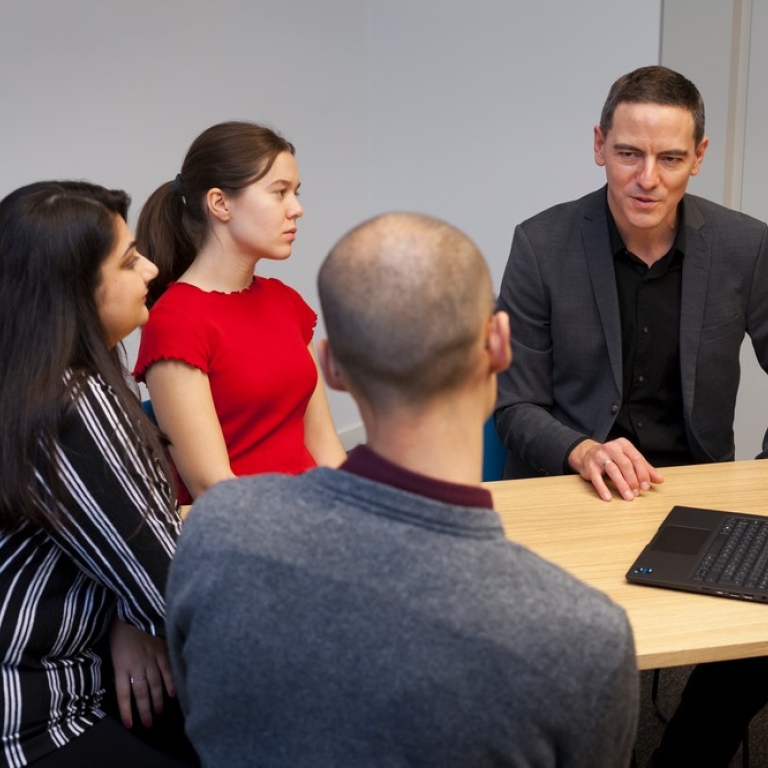 Students with a consultant from the Academic Writing Service.