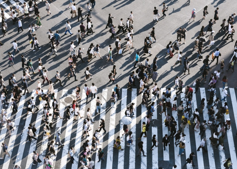 Photo: Ryoji Iwata/Unsplash People crossing a street