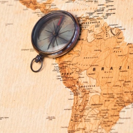 World map with compass showing south america. Photo by Mostphotos