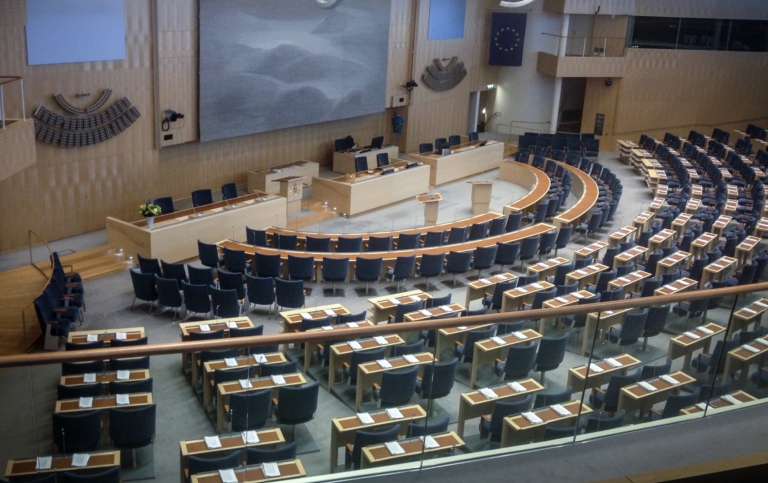 Bild på plenisalen i Sveriges riksdag.