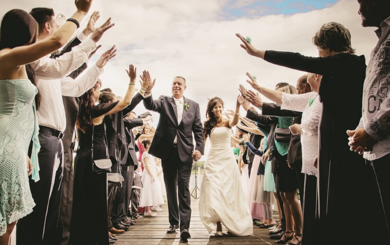 Wedding couple with wedding guests