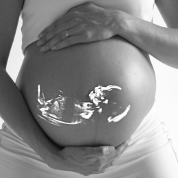 Pregnant woman with image of foetus