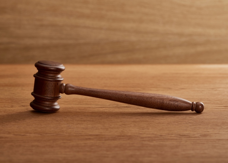 wooden gavel on brown wooden table
