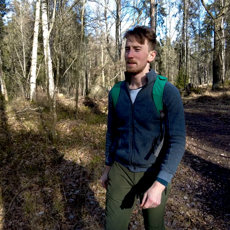 Liam Moran talks a walk in the forest.