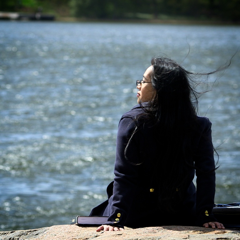 Janna Aquino sitting by the sea