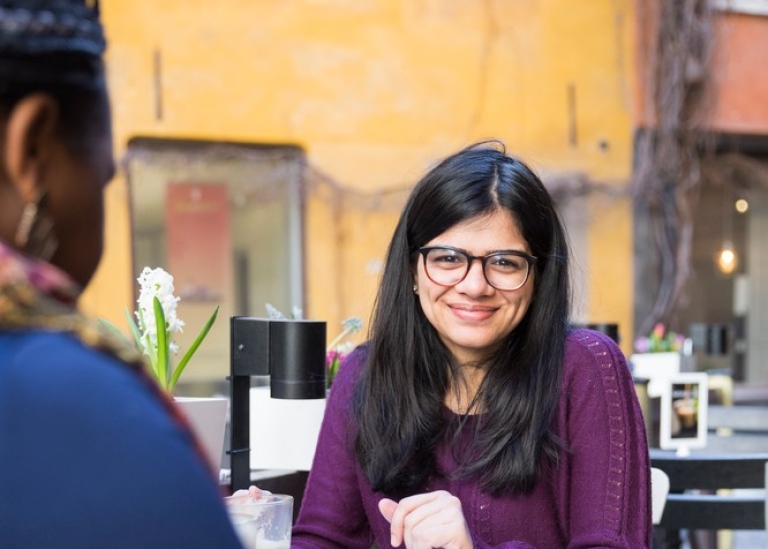 Female student at a café in the Old Town in Stockholm.