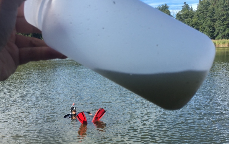 Heavily turbid water sample collected by India in snorkelling gear. Photo: Joakim Hansen