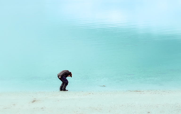 Man in a suit on a beach