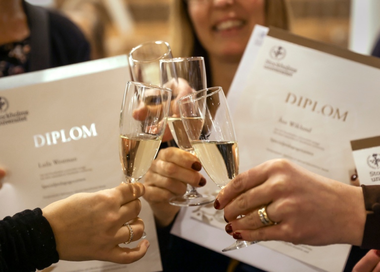 Champagne glasses in front om Diplomas. Photo: Sören Andersson.
