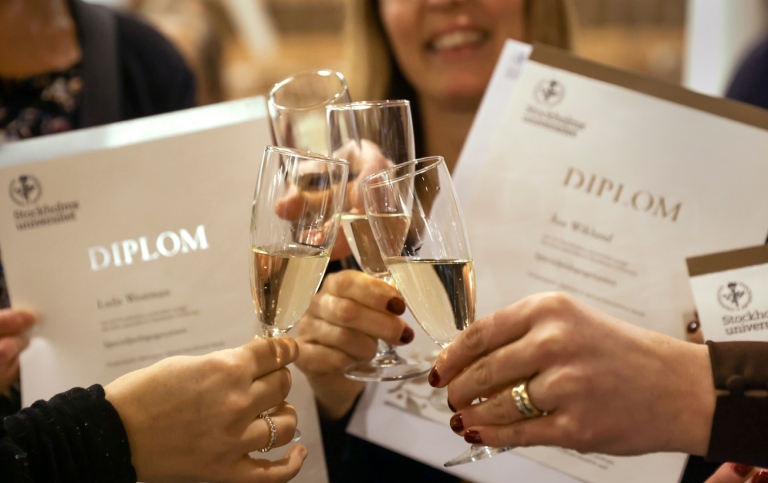 Champagne glasses in front om Diplomas. Photo: Sören Andersson.