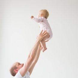 A father holding an infant