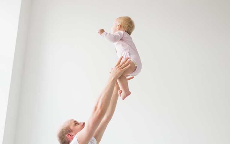 A father holding an infant