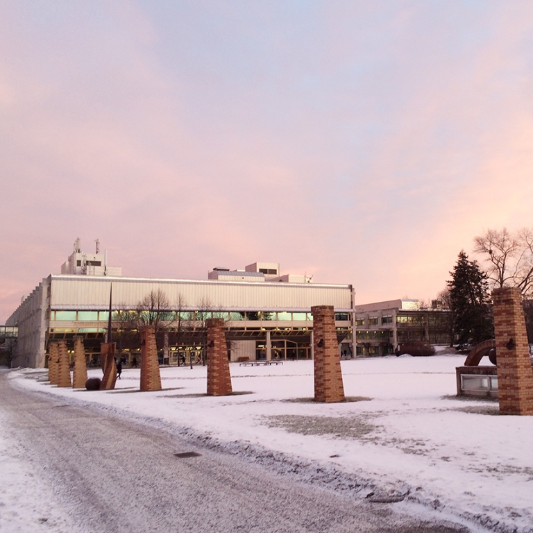 Snow-covered ground with the Arrhenius Laboratory in the background