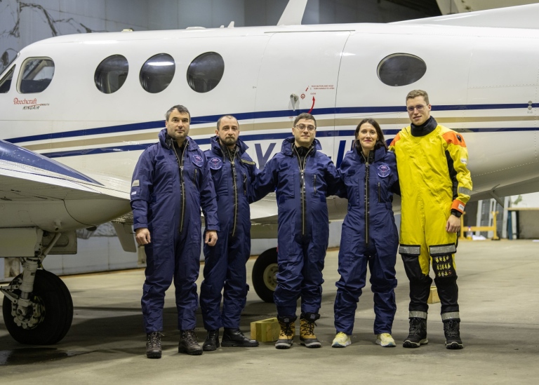 Research team by airplane. Photo: Terje Megård
