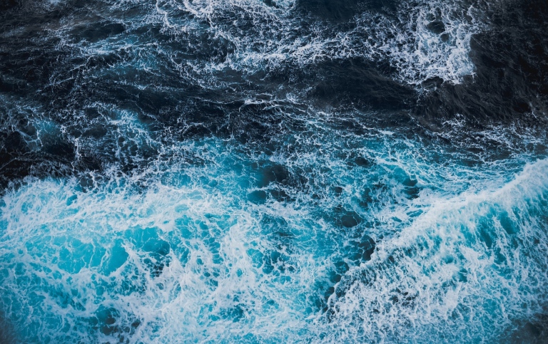 Rough waters. Drone view of waves.