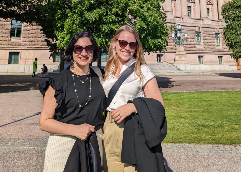 my Heshmati and Helena Honkaniemi, both wearing shades, in front of the Swedish Parliament.