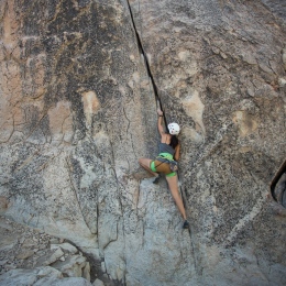 Woman climbing a mountain