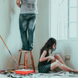 A couple painting their apartment