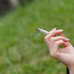 Hand holding a cigarette